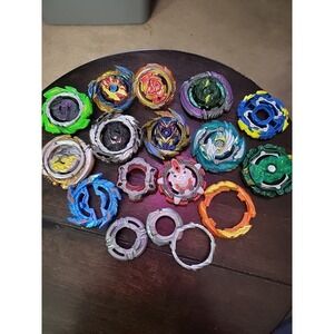 Lot of mixed Beyblade misc parts, bey top pieces and other as seen